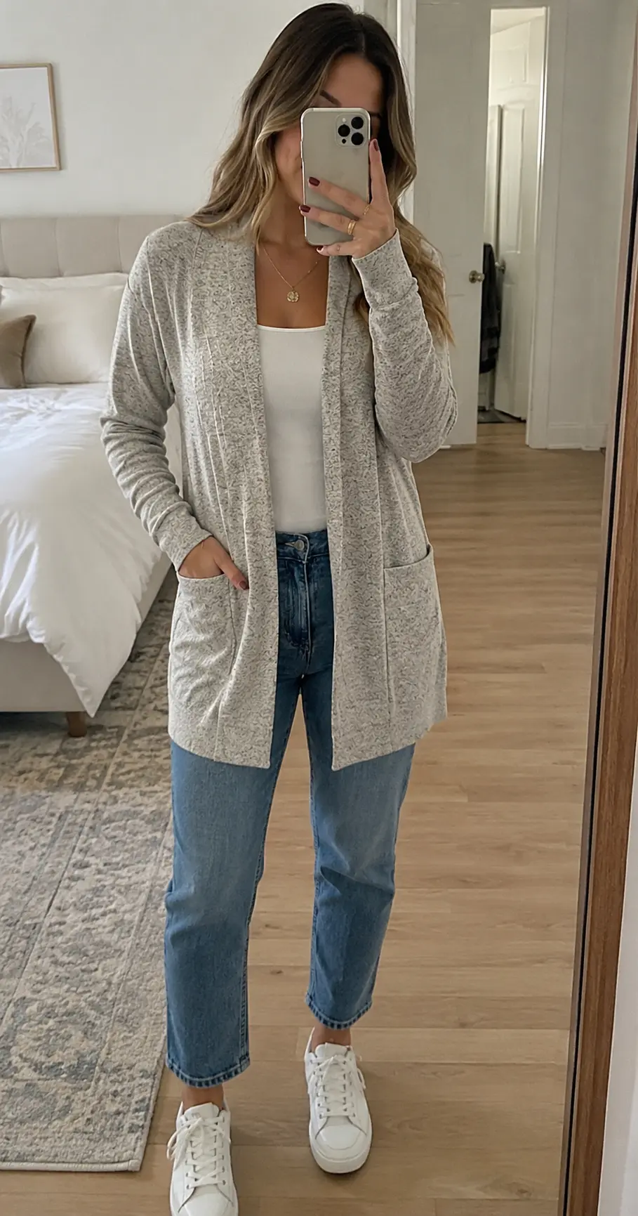 Black version of the cardigan layered over a slip dress for a holiday party outfit