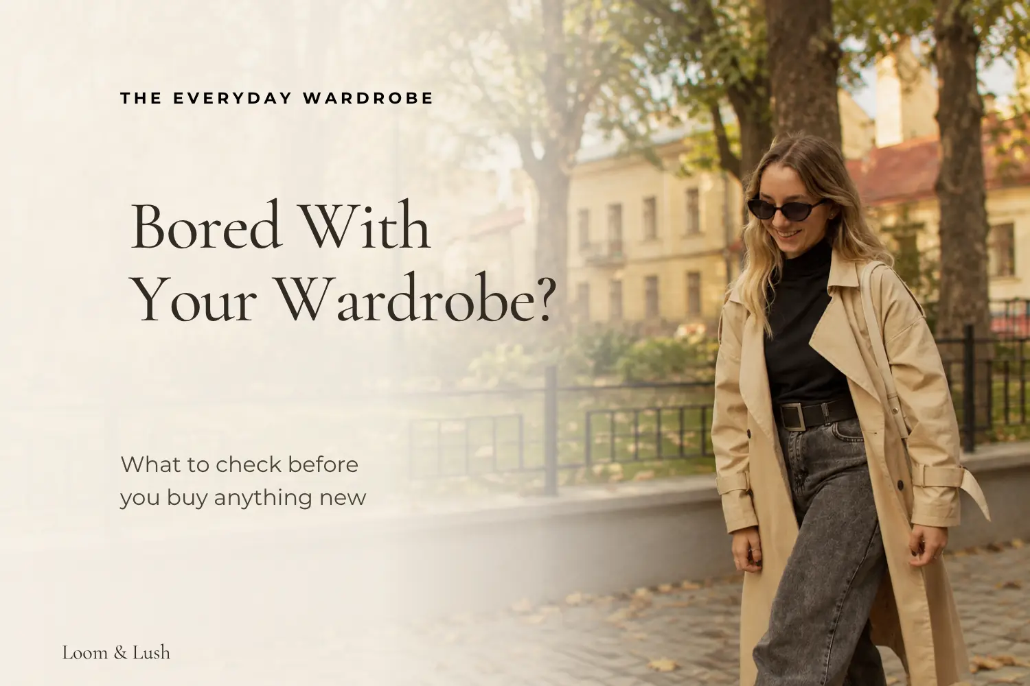 Woman in a beige trench coat and jeans walking outdoors in fall